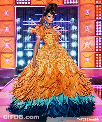 Drag Queen In Yellow And Blue Feathered Dress GIF