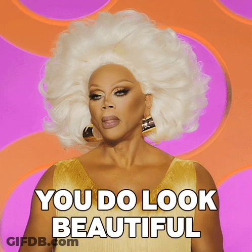 A Drag Queen Says You Do Look Beautiful On A Pink Background GIF