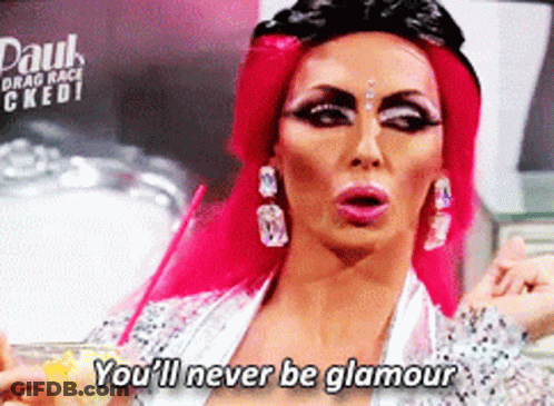 A Drag Queen Says " You 'Ll Never Be Glamour " While Holding A Drink GIF