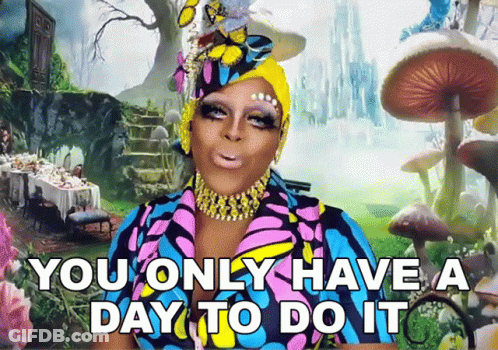 A Drag Queen Says " You Only Have A Day To Do It " In Front Of Alice In Wonderland Background GIF