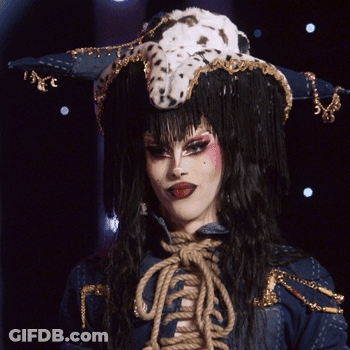 A Drag Queen Wearing A Dalmatian Hat Says " Evening Ma'am " GIF
