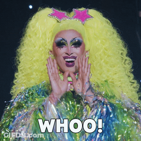 A Drag Queen With A Yellow Wig And A Pink Star On Her Head Says " Whoo " GIF