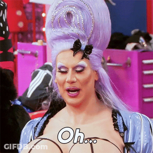 Drag Queen With Purple Hair And Crown Says Oh GIF