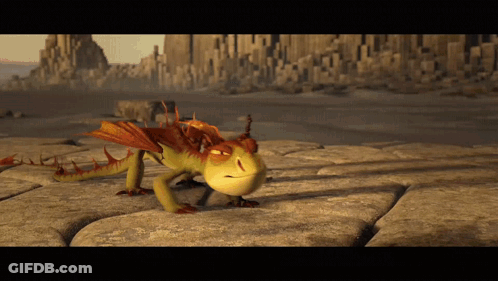 A Dragon From How To Train Your Dragon Is Crawling On A Rock GIF
