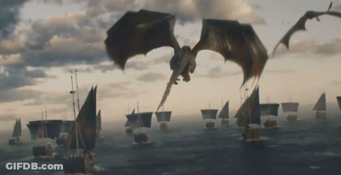 A Dragon Is Flying Over A Body Of Water GIF