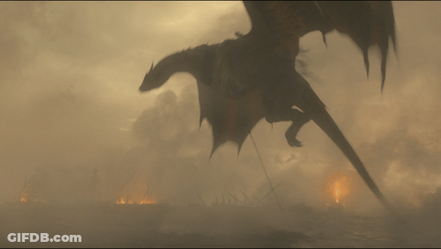 A Dragon Is Flying Over A Burning City In The Fog GIF