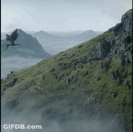 A Dragon Is Flying Over A Mountain Covered In Grass GIF