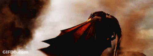 A Dragon Is Flying Through A Cloudy Sky With Smoke Coming Out Of It 'S Mouth . GIF