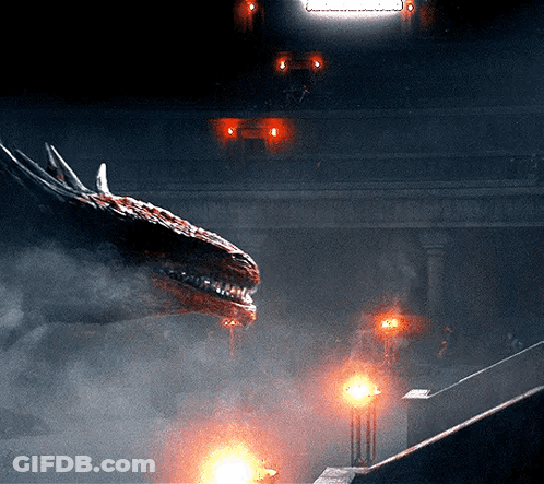 A Dragon Is Flying Through The Air In A Dark Room With A Sign That Says ' A ' On It GIF