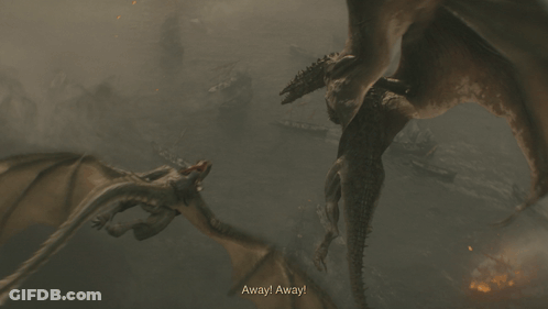 A Dragon Is Flying Through The Air With Flames Coming Out Of It 'S Mouth GIF