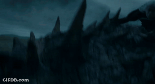 A Dragon Is Flying Through The Air With Its Wings Outstretched GIF