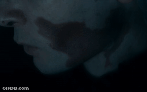 A Dragon Is Laying On The Ground With Its Wings Outstretched GIF