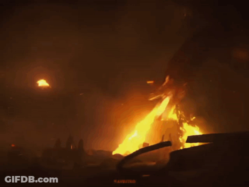 A Dragon Is Surrounded By Flames And A Sign That Says " Ravaging " GIF