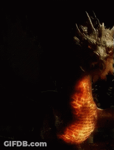 A Dragon Is Surrounded By Flames And Smoke GIF