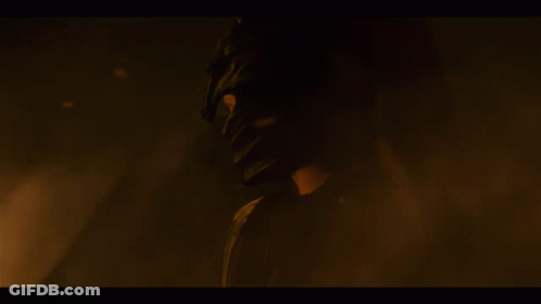 A Dragon With A Long Neck Is Surrounded By Flames And Smoke GIF