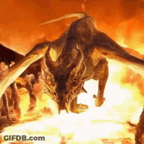 A Dragon With Wings Is Flying Through The Air In Front Of A Fire . GIF