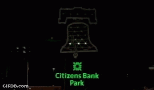 A Drawing Of A Bell On A Black Background . GIF