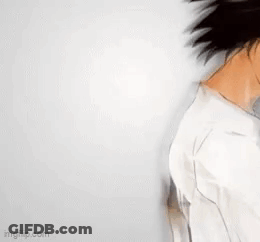 A Drawing Of A Man With Long Black Hair And A White Shirt . GIF
