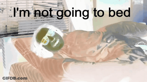 A Drawing Of A Person Laying On A Bed With The Words " I 'M Not Going To Bed " Above Them GIF