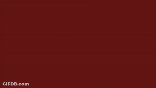 A Drawing Of A Red And Black Swirl GIF