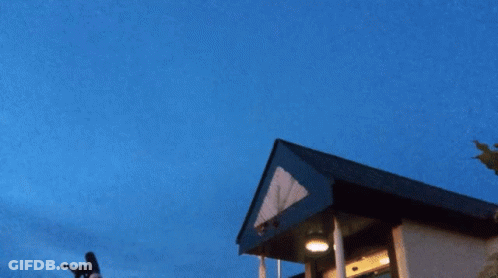 A Drawing Of A Swirling Object With A Blue Sky In The Background GIF