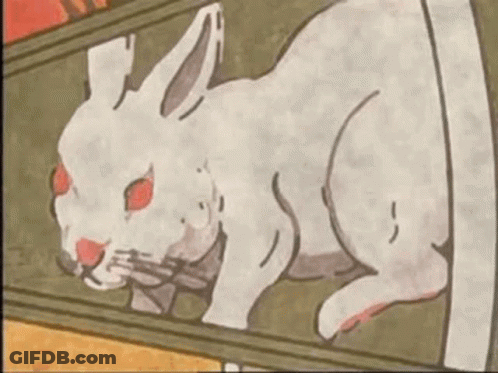A Drawing Of A White Rabbit With Red Eyes Laying On A Table . GIF