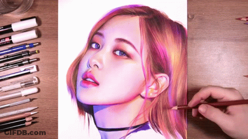 A Drawing Of A Woman 'S Face Is Being Drawn By A Person With A Pencil GIF
