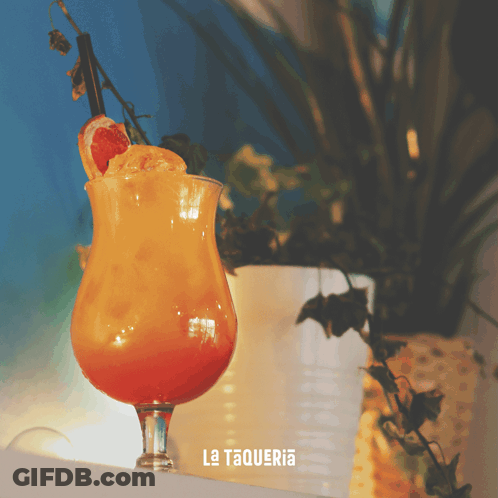 A Drink In A Glass With La Taqueria Written On It GIF