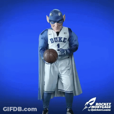 A Duke Basketball Player In A Superhero Costume Holds A Basketball GIF