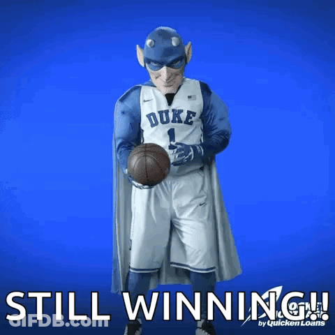 A Duke Basketball Player Is Holding A Basketball In His Hands GIF