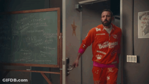 A Dunkin ' Barrel With A Person Covered In Chocolate GIF