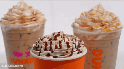 A Dunkin Donuts Cup With Whipped Cream On Top GIF