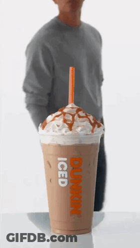 A Dunkin ' Donuts Iced Coffee With Whipped Cream And Caramel Sauce GIF