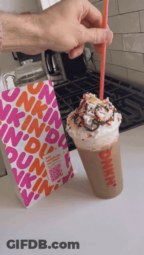 A Dunkin ' Donuts Milkshake With Whipped Cream And Sprinkles GIF