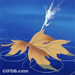 A Fairy Is Flying Over A Maple Leaf GIF