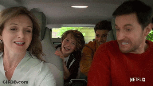 Family Sitting In Car Back Seat With Netflix Logo GIF