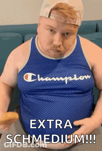 A Fat Man In A Champion Tank Top Is Eating A Donut GIF