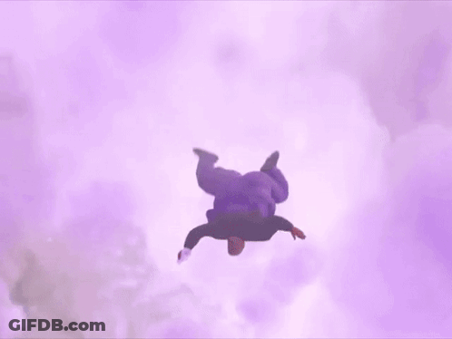 A Fat Man In A Purple Shirt Is Flying Through The Air Holding A Wii Remote . GIF