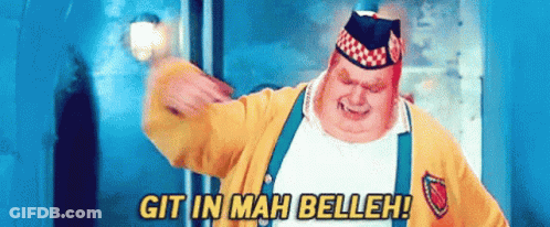 A Fat Man In A Yellow Jacket And Suspenders Is Saying Git In Mah Belleh GIF