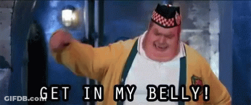 A Fat Man In A Yellow Jacket And Suspenders Says Get In My Belly ! GIF