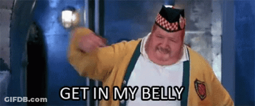 A Fat Man In A Yellow Sweater And Hat Is Saying Get In My Belly GIF