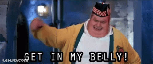 A Fat Man In A Yellow Sweater Is Saying Get In My Belly GIF