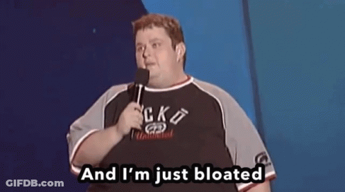 A Fat Man Is Holding A Microphone And Saying And I 'M Just Bloated GIF