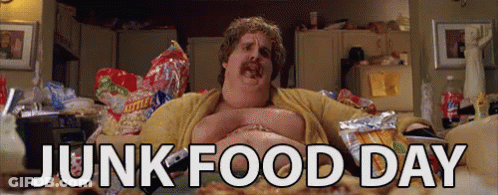 A Fat Man Is Laying On A Couch With Junk Food Day Written In White Letters GIF