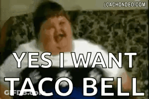 A Fat Man Is Sitting On A Couch With His Eyes Closed And Says `` Yes I Want Taco Bell '' . GIF