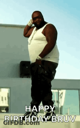 A Fat Man Is Standing In Front Of A Building With The Words Happy Birthday Bruv On The Bottom GIF