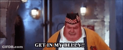 A Fat Man Wearing A Hat And A Sweater Is Saying `` Get In My Belly '' . GIF