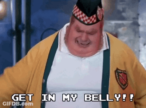 A Fat Man Wearing A Yellow Jacket And A Hat Is Saying Get In My Belly . GIF