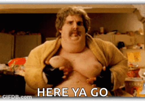 A Fat Man With A Mustache Is Holding His Chest With The Words Here Ya Go Written Below Him GIF