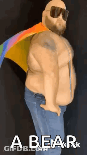 A Fat Man With A Rainbow Flag Around His Neck Is Wearing Sunglasses And A Cape . GIF